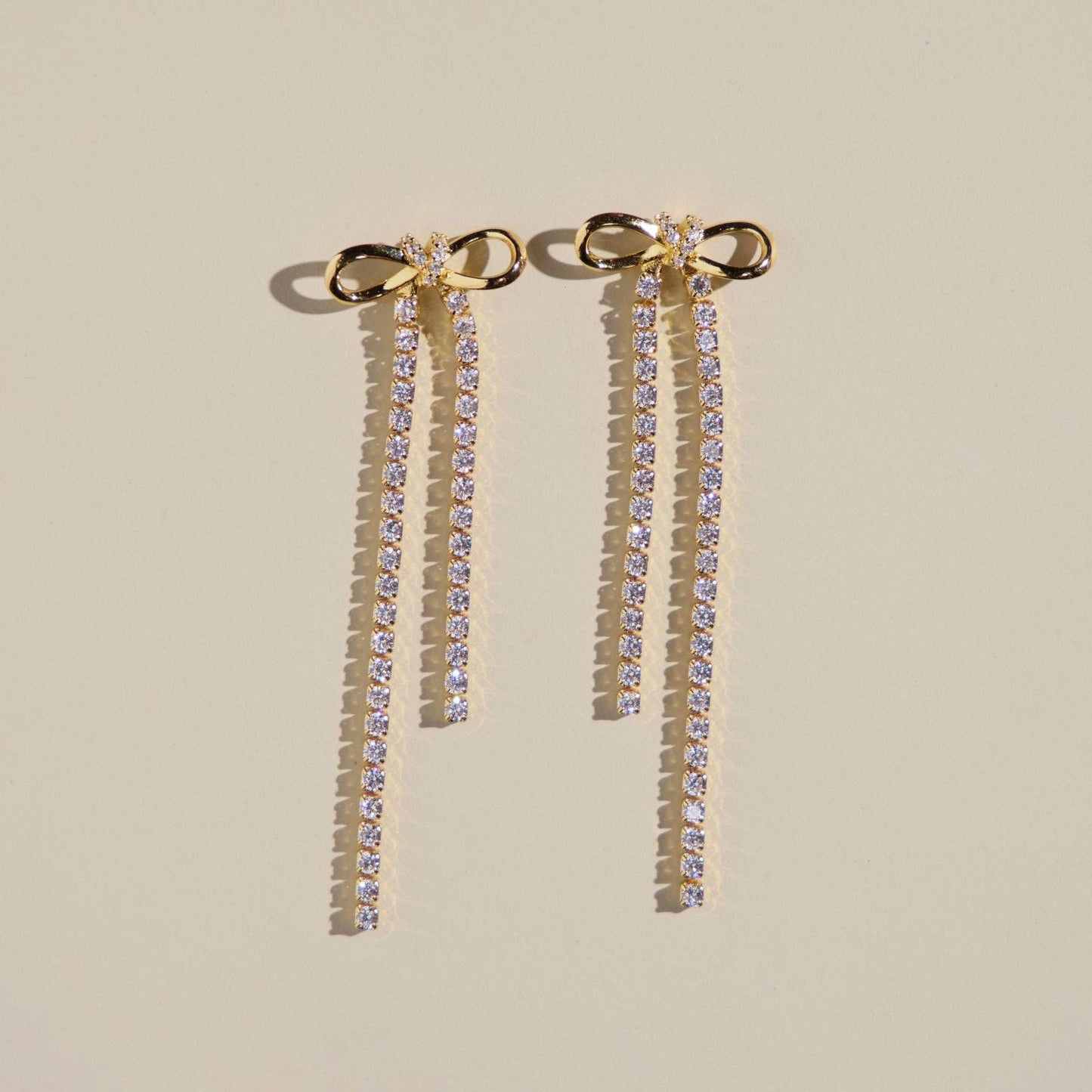 Gold Long Crystal Bow Drop Studs: Gold